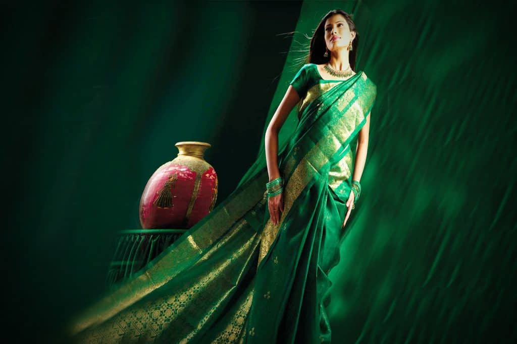 bottle green color saree with golden border