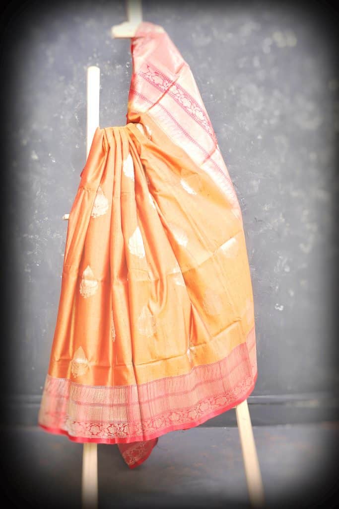 peach color saree with a tune of gold